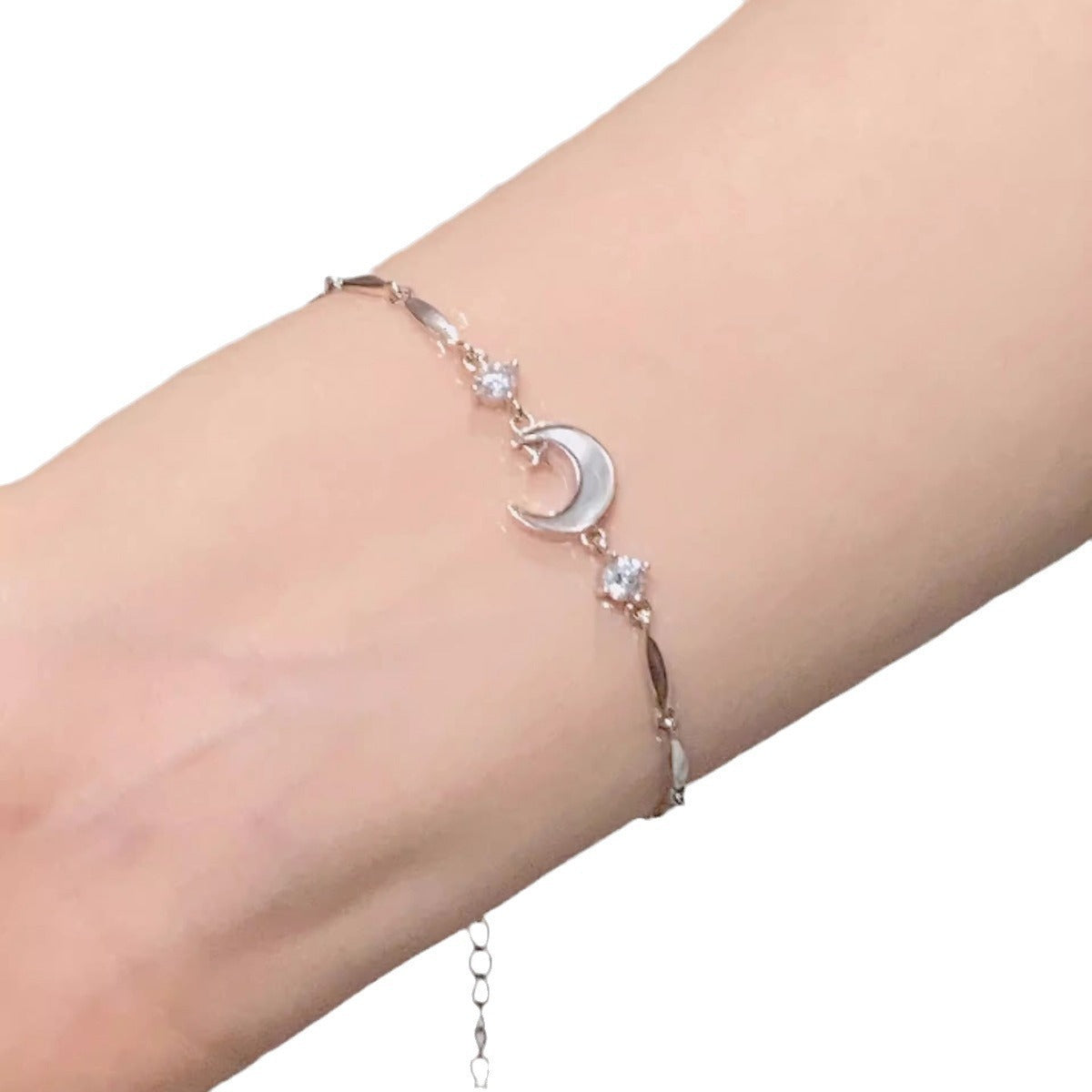 Silver-tone star and moon crystal charm bracelet