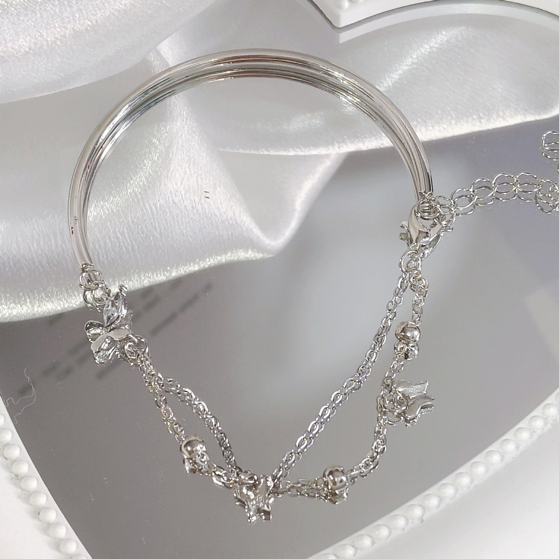 Silver-tone butterfly cubic zirconia tassel bracelet