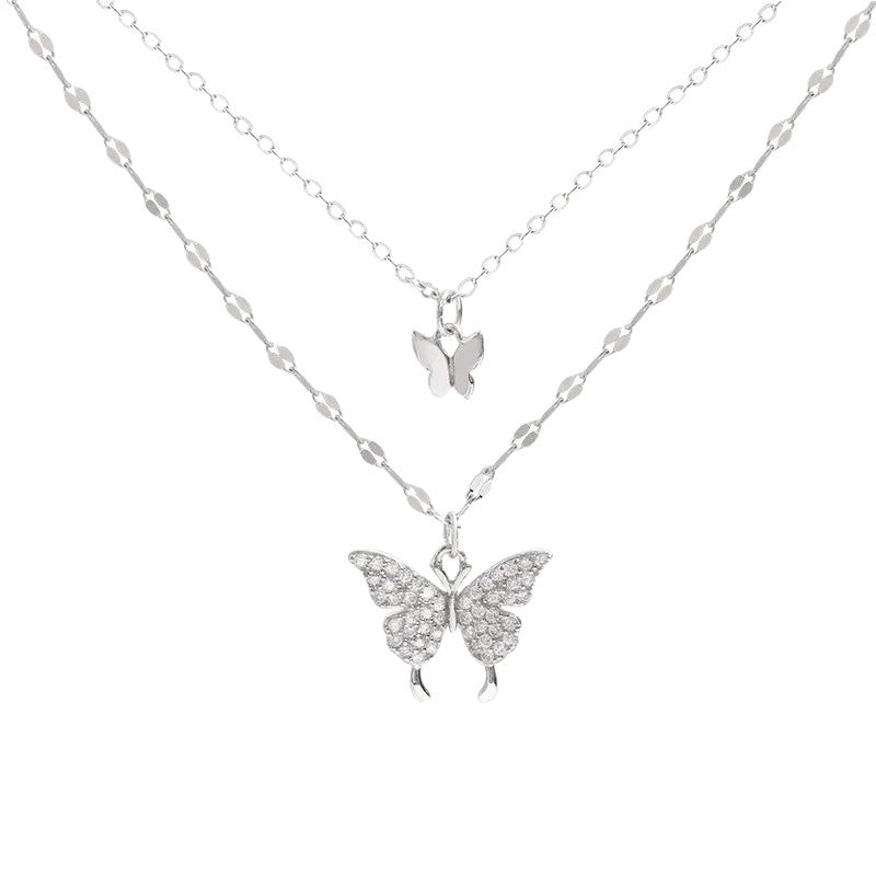 Layered butterfly pendant necklace with delicate chain detail