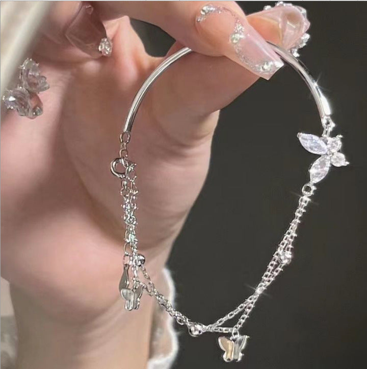 Silver-tone butterfly cubic zirconia tassel bracelet