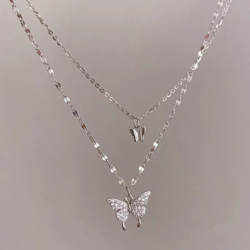 Layered butterfly pendant necklace with delicate chain detail