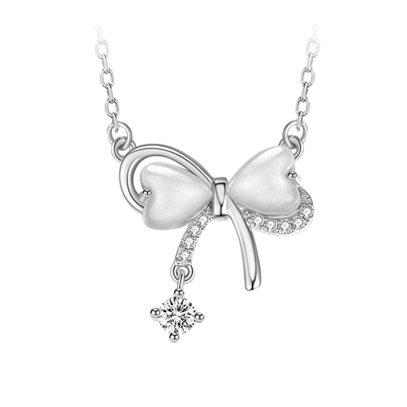 Bow pendant tassel necklace with delicate drop-chain detail