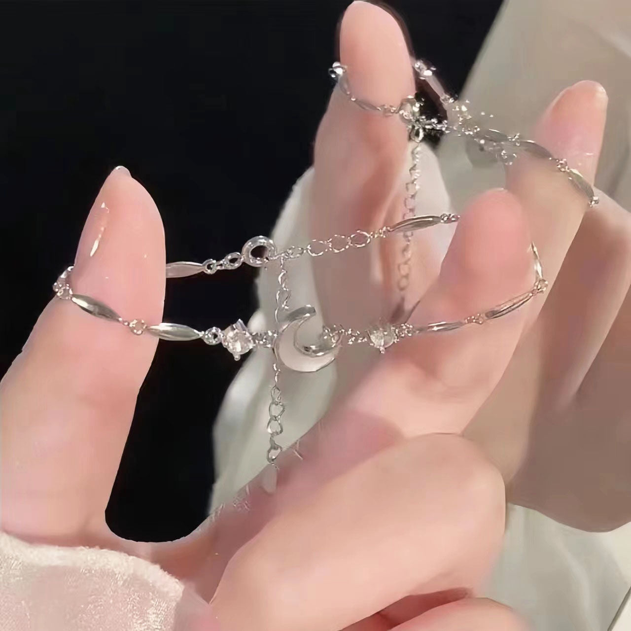 Silver-tone star and moon crystal charm bracelet