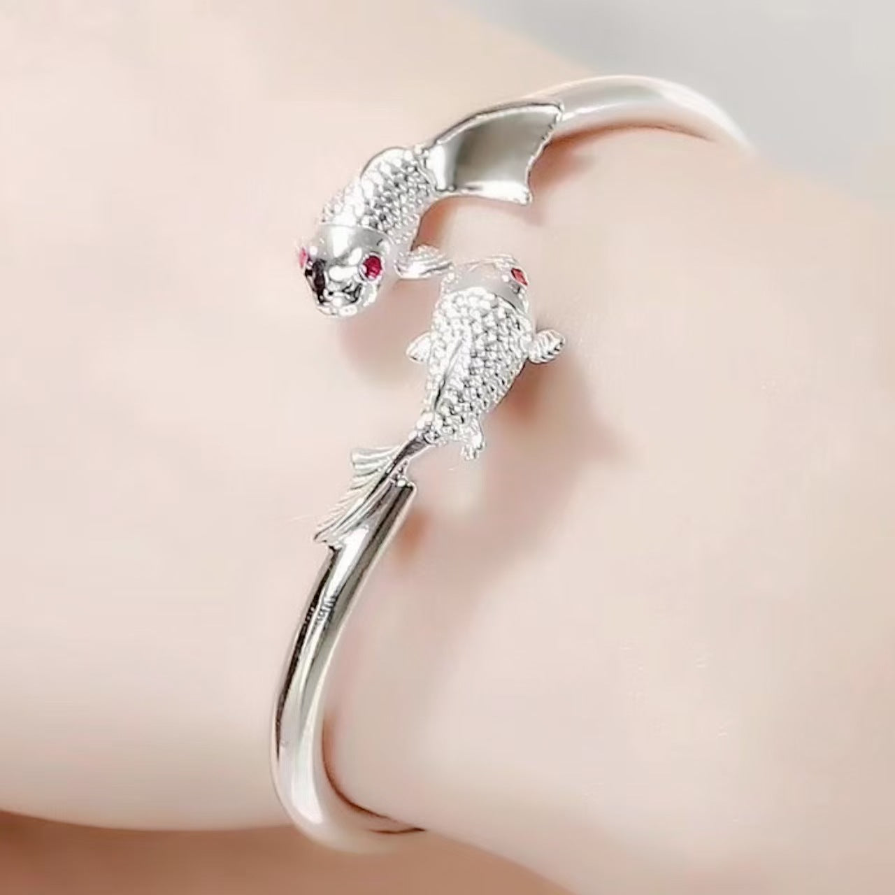 Silver-tone double koi fish red-eye bracelet
